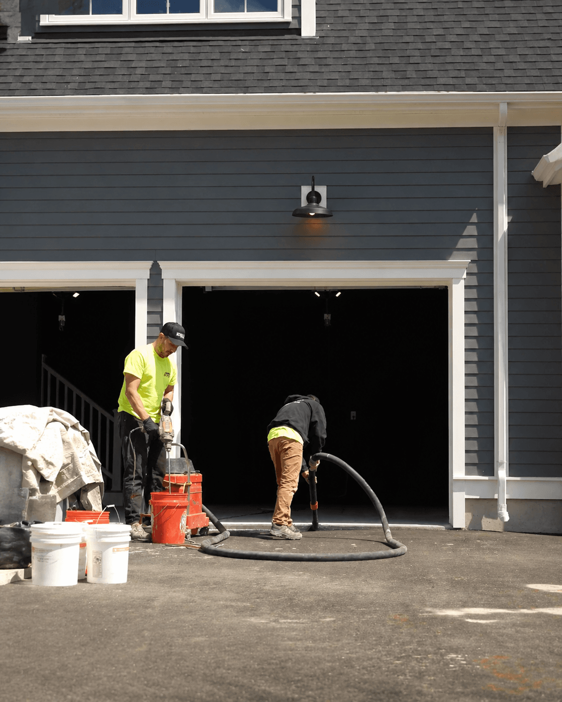 Our team in action installing epoxy flooring